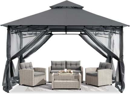 The gazebo is set up in the backyard with netting for protection from insects and sun exposure.